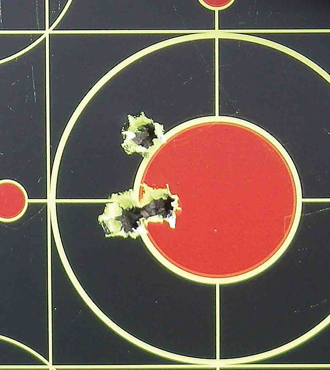 The Model 48 and .33 Nosler proved an accurate combination, with several three-shot groups hovering under .5-inch. This four-shot group was fired at 100 yards, with the upper bullet being “pulled” by the shooter.
